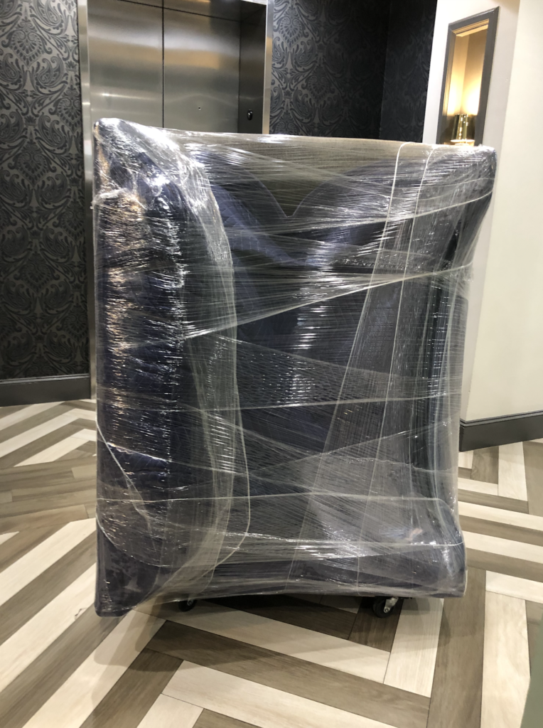 Couch wrapped and protected for moving